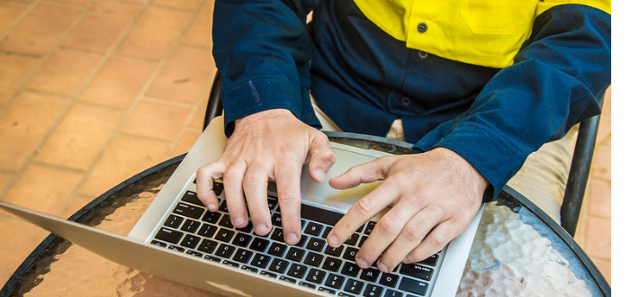 Man typing on laptop